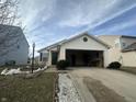 Ranch home with attached garage and landscaping at 1810 Farm Meadow Dr, Greenwood, IN 46143