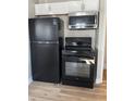 Modern black kitchen appliances including range, oven, and microwave at 2414 Walker Ave, Indianapolis, IN 46203
