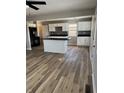 Spacious kitchen featuring a large island, white cabinets, and granite countertops at 2414 Walker Ave, Indianapolis, IN 46203