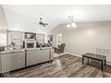 Bright living room with a vaulted ceiling, fireplace, hardwood floors, and neutral decor at 2427 Manita Dr, Indianapolis, IN 46234