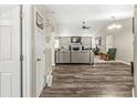 Spacious living room with hardwood floors, fireplace, ceiling fan, and open layout at 2427 Manita Dr, Indianapolis, IN 46234