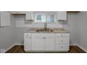 White shaker cabinets and a new stainless steel sink at 2875 Adams St, Indianapolis, IN 46218