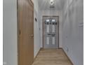 Interior entry with gray door and wood flooring at 5364 Milhouse Rd, Indianapolis, IN 46221