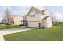 Two-story house with a large yard and a driveway, viewed from the side at 55 Markleville Ln, Westfield, IN 46074