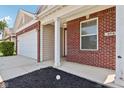 Front entrance of brick ranch home with garage at 573 New Moon St, Avon, IN 46123