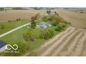 Aerial view showing house, large yard, and surrounding farmland at 5965 Grassy Rd, Lebanon, IN 46052