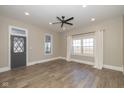 Spacious living room with hardwood floors and large windows at 5965 Grassy Rd, Lebanon, IN 46052