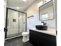 Beautiful bathroom features a glass shower, black fixtures, and modern vanity sink at 6775 N County Road 550 E, Brownsburg, IN 46112