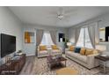 A spacious living room featuring hardwood floors, neutral decor and plenty of natural light at 711 W 24Th St, Anderson, IN 46016
