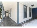 Inviting front porch featuring a wooden floor, classic columns, and ample space for relaxing at 747 E Mccarty St, Indianapolis, IN 46203