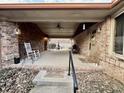 Spacious covered patio featuring brick accents, a ceiling fan, and ample room for outdoor furniture and activities at 1072 S State Road 67, Martinsville, IN 46151