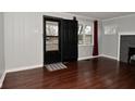 Cozy entryway with dark wood floors, a door, and a window at 110 Tulip Dr, Indianapolis, IN 46227