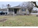A well-maintained home with stone details and a covered front porch at 110 Tulip Dr, Indianapolis, IN 46227