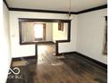 View of the living room showcasing the original hardwood floors and bright light at 1258 W 29Th St, Indianapolis, IN 46208
