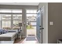 Inviting entryway with hardwood floors and sun-filled windows, offering a warm welcome at 2231 Colfax Ln, Indianapolis, IN 46260