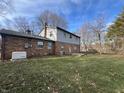 A spacious backyard features a well-kept lawn, mature trees, and a patio for outdoor enjoyment at 2559 Pleasant W Way, Carmel, IN 46280