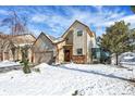 Two story house with snow covered yard and sunroom addition at 397 Polk Village Rd, Greenwood, IN 46143