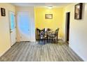 Open dining room showcasing laminate flooring, neutral walls, and natural light at 4114 N Butler Ave, Indianapolis, IN 46226