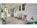 Cozy front porch features seating and ample space for relaxing at 460 W Morgan St, Martinsville, IN 46151