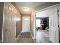 Inviting foyer with neutral walls, laminate floors, and views of the living space at 5782 Jamestown Square Ln, Indianapolis, IN 46234