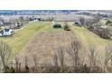 Panoramic aerial view of the property in a rural setting, with distant homes and agricultural land at 5802 Watson Rd, Greenwood, IN 46143