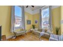 Bright living room with hardwood floors and large windows at 714 Buchanan St # 5, Indianapolis, IN 46203