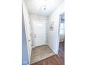 Bright entryway with new tile floors and a white door at 8139 Hi Vu Dr, Indianapolis, IN 46227
