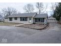 Inviting single story home with a detached garage and mature landscaping at 8505 W Jackson St, Muncie, IN 47304