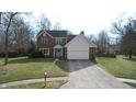 Charming two-story brick home featuring an attached two-car garage and a lush front lawn at 9139 Kelsey Ct, Fishers, IN 46037