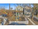 Charming home featuring an inviting front porch, a white picket fence and a nearby playground, perfect for Gathering enjoyment at 1515 Ringgold Ave, Indianapolis, IN 46203