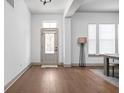 Bright entryway features hardwood floors, neutral walls, and ample natural light from the windows at 16012 Forewood Ln, Fishers, IN 46037