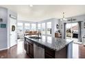 Modern kitchen with stainless steel appliances and an island with a granite countertop at 16457 Anderson Way, Noblesville, IN 46062