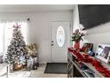 Bright entryway with a decorated Christmas tree and festive holiday décor at 3144 Voigt Dr, Indianapolis, IN 46224