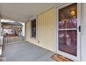 Front porch with a door and side windows at 317 N Arsenal Ave, Indianapolis, IN 46201