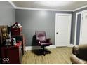 This small office area has wood look flooring and a vintage Route 66 sign at 3306 N Drexel Ave, Indianapolis, IN 46218