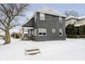 The exterior of this lovely home showcases unique architectural details and a tidy yard at 602 N Harrison St, Alexandria, IN 46001