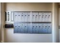Row of silver mailboxes in a hallway, with mail drop box at 714 Buchanan St # 17, Indianapolis, IN 46203