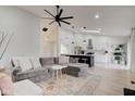 Bright living room with modern decor, high ceilings, and open concept to kitchen at 8349 Tequista Cir, Indianapolis, IN 46236