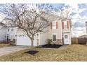 Charming two-story home with red shutters and a well-manicured lawn, providing excellent curb appeal at 9703 W Stargazer Dr, Pendleton, IN 46064