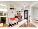 Elegant foyer with hardwood floors, chandelier, decorative mirror, and stylish furnishings at 1006 Cherry Tree Ln, Greenwood, IN 46143