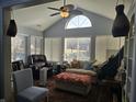 Inviting living room with large windows and vaulted ceilings providing ample natural light at 1016 Laurelwood Ln # D, Greenwood, IN 46142