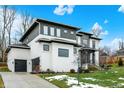 Stylish home with a two-car garage, modern design, and a well-kept lawn at 10519 Geist View Dr, Fishers, IN 46055