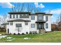 Beautiful two-story home featuring modern design, stone accents, and well-maintained lawn at 10519 Geist View Dr, Fishers, IN 46055
