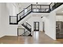Bright and airy foyer with staircase, modern railings, and an open floor plan at 10519 Geist View Dr, Fishers, IN 46055