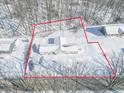 An aerial shot of a home with snow-covered yard and a boundary line around the property at 1090 Robb Hill Rd, Martinsville, IN 46151