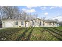 Single story home with neutral siding, an attached garage, and well maintained lawn at 1090 Robb Hill Rd, Martinsville, IN 46151