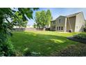 Expansive backyard with a lush green lawn and mature trees at 12899 Star Dr, Fishers, IN 46037