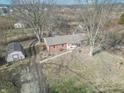 Aerial view of a home featuring a quaint yard, mature trees and a detached shed at 6170 S County Road 675 E Rd, Plainfield, IN 46168