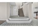 Spacious foyer with tile flooring, staircase, and access to the living areas at 6366 Amber Pass, Plainfield, IN 46168