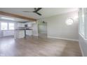 Open-concept living room featuring hardwood floors and an open view to the kitchen at 7302 N Banta Rd, Bargersville, IN 46106